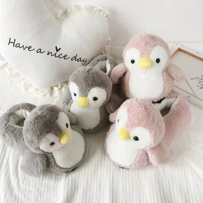 Pair of cosy, plush home slippers featuring a playful penguin design