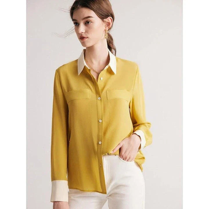 A chic and elegant silk crepe de chine blouse in a timeless solid pattern, perfect for professional and casual wear.
