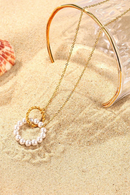 Elegant 18K gold-plated pearl hoop necklace with a lustrous synthetic pearl centrepiece