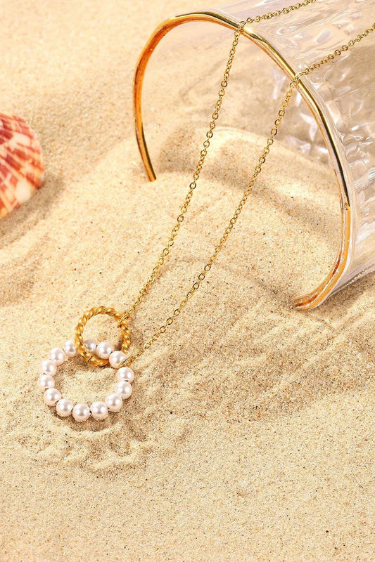 Elegant 18K gold-plated pearl hoop necklace with a lustrous synthetic pearl centrepiece