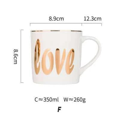 Elegant porcelain coffee mug with a lustrous gold heart design, perfect for enjoying hot beverages in style.