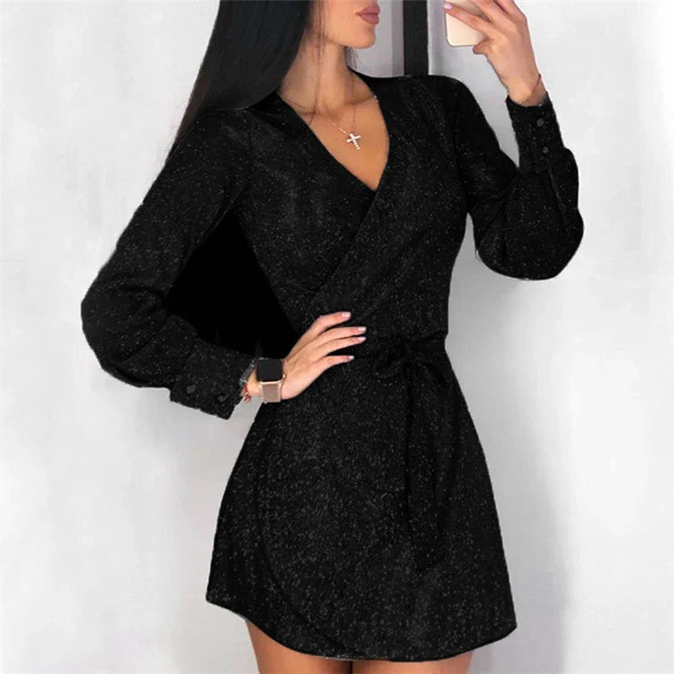 A glamorous midi dress with a lace overlay and sparkling silver sequin details, perfect for special occasions.