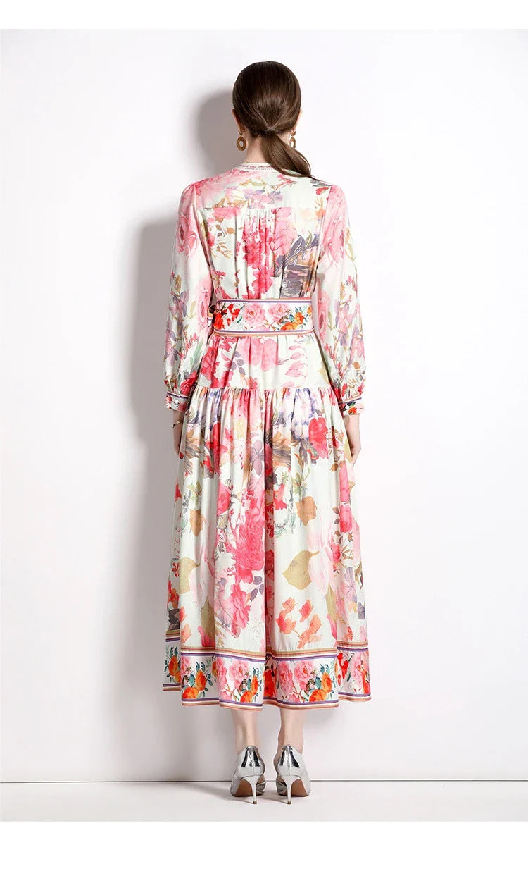 Elegant floral single-breasted swing dress with delicate print, tailored design, and flowing silhouette