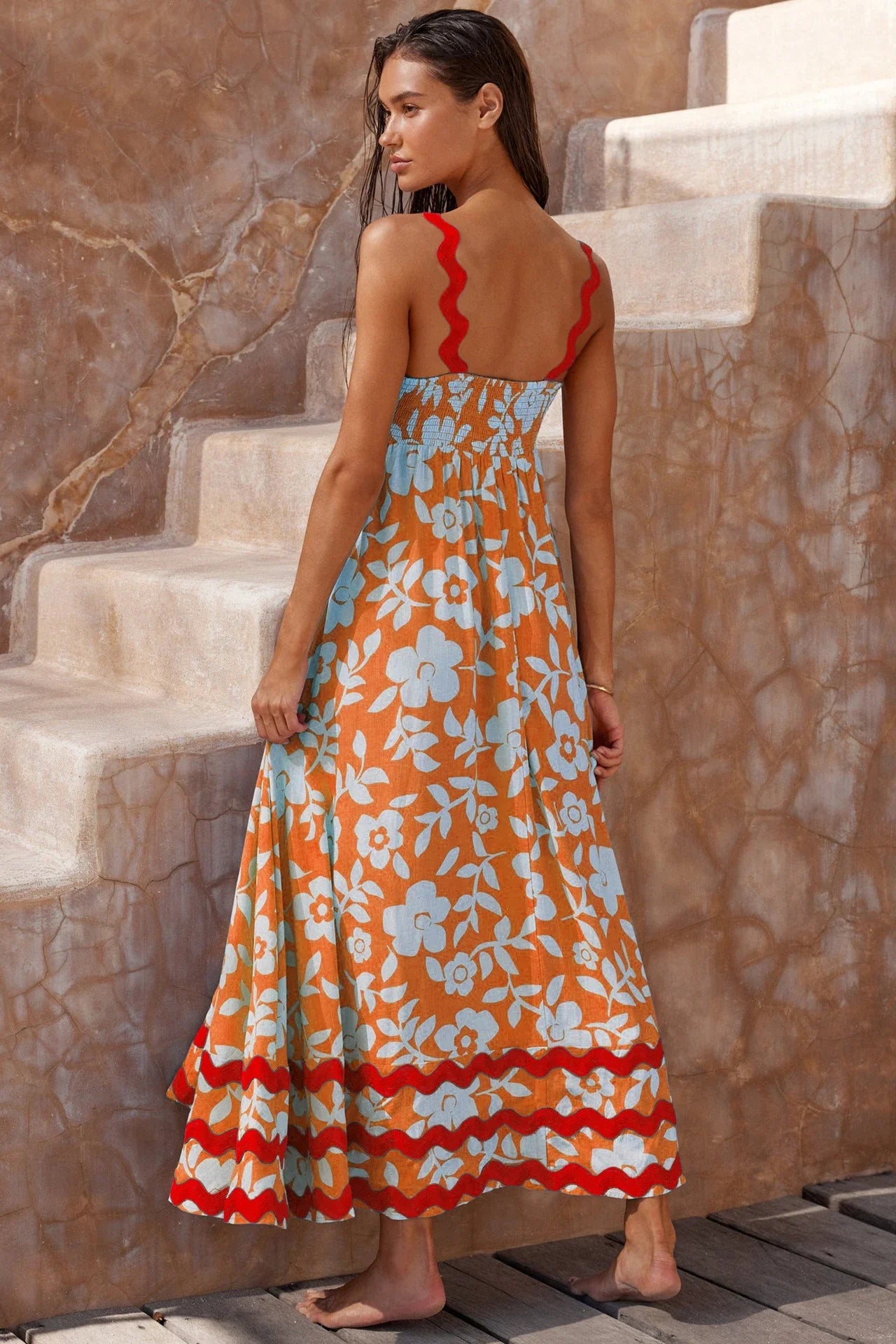 Elegant floral print suspender midi dress in black, perfect for summer beach holidays in the UK