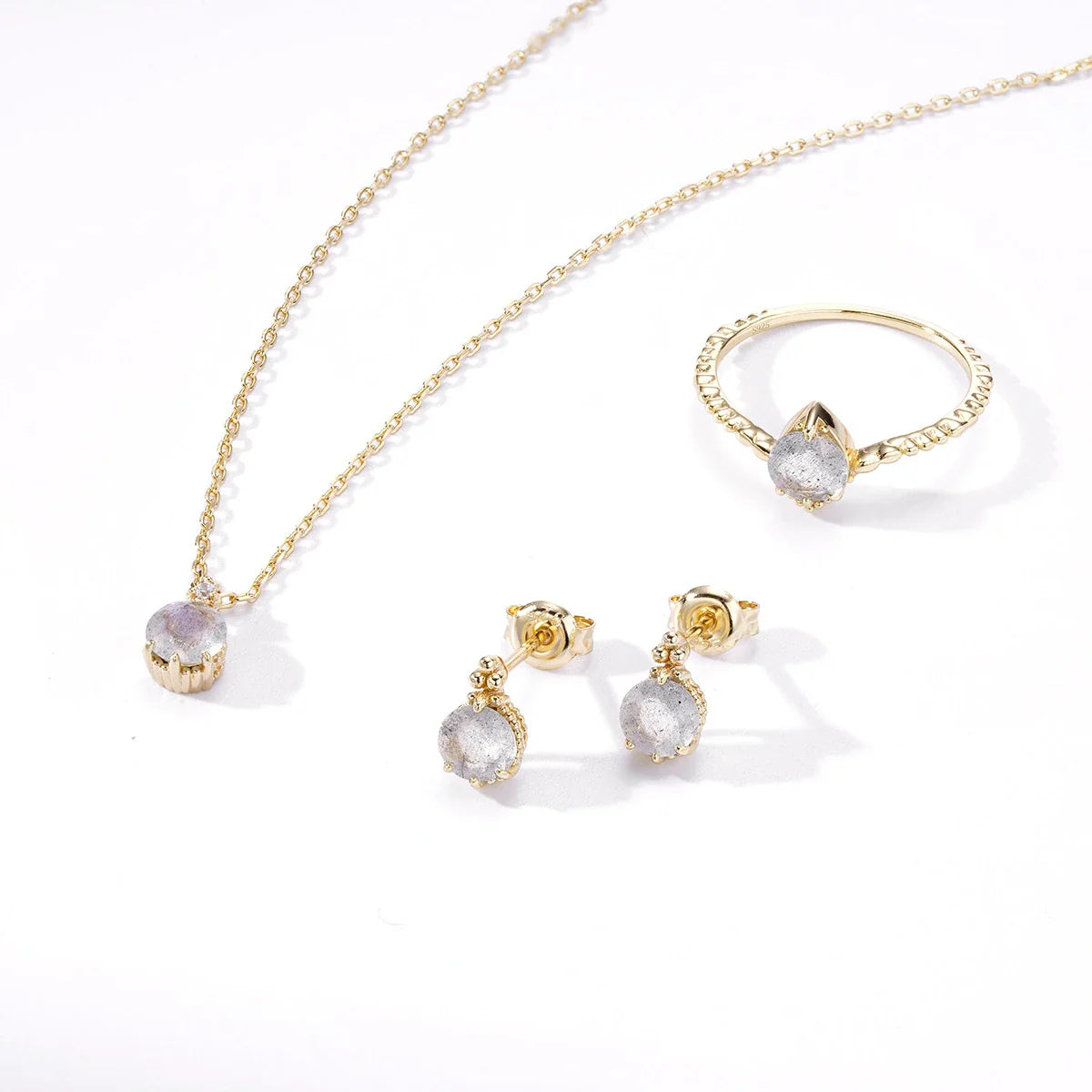 Elegant elongated stone earrings with a geometric design and a white crystal, a sophisticated accessory for the discerning British woman.