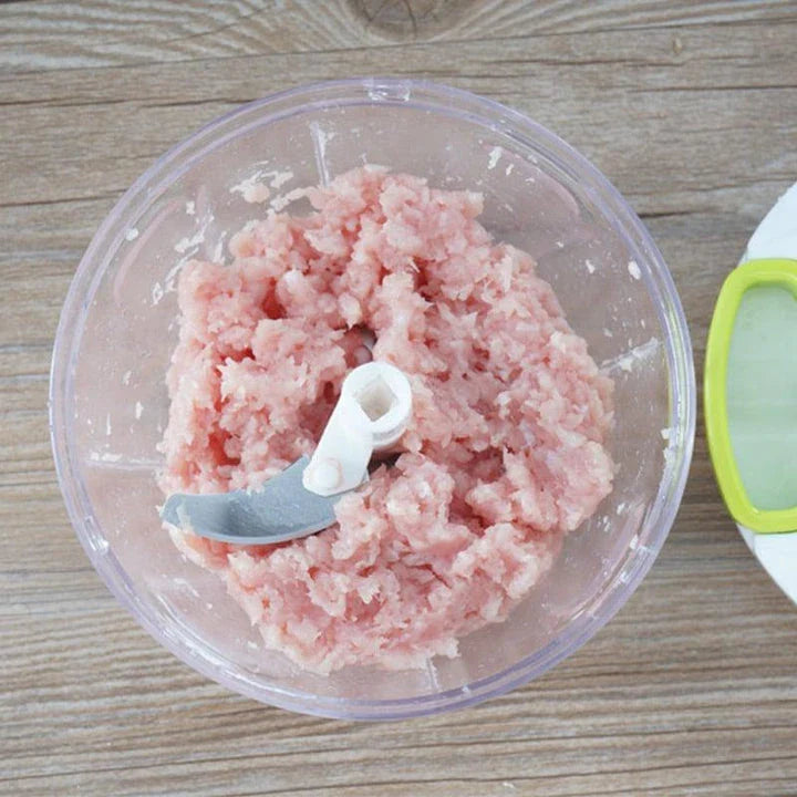 Portable Hand Pull Food Chopper with light green body and 3 sharp blades for easy chopping, slicing, and dicing in UK kitchens