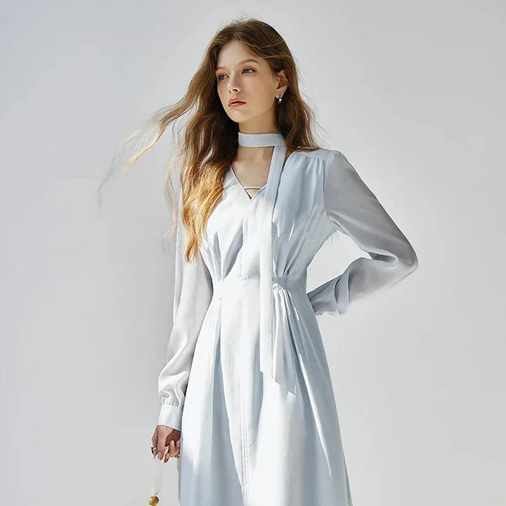 Elegant French-style v-neck light blue ribbon dress with puff sleeves and A-line silhouette