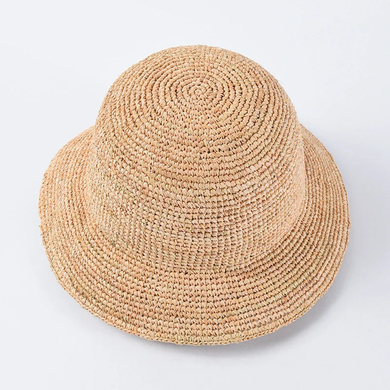 Handcrafted raffia sun hat for women, with a flat brim design and adjustable sizing for versatile sun protection and stylish summer wear