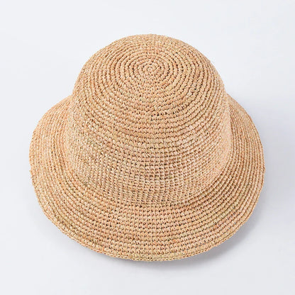 Handcrafted raffia sun hat for women, with a flat brim design and adjustable sizing for versatile sun protection and stylish summer wear
