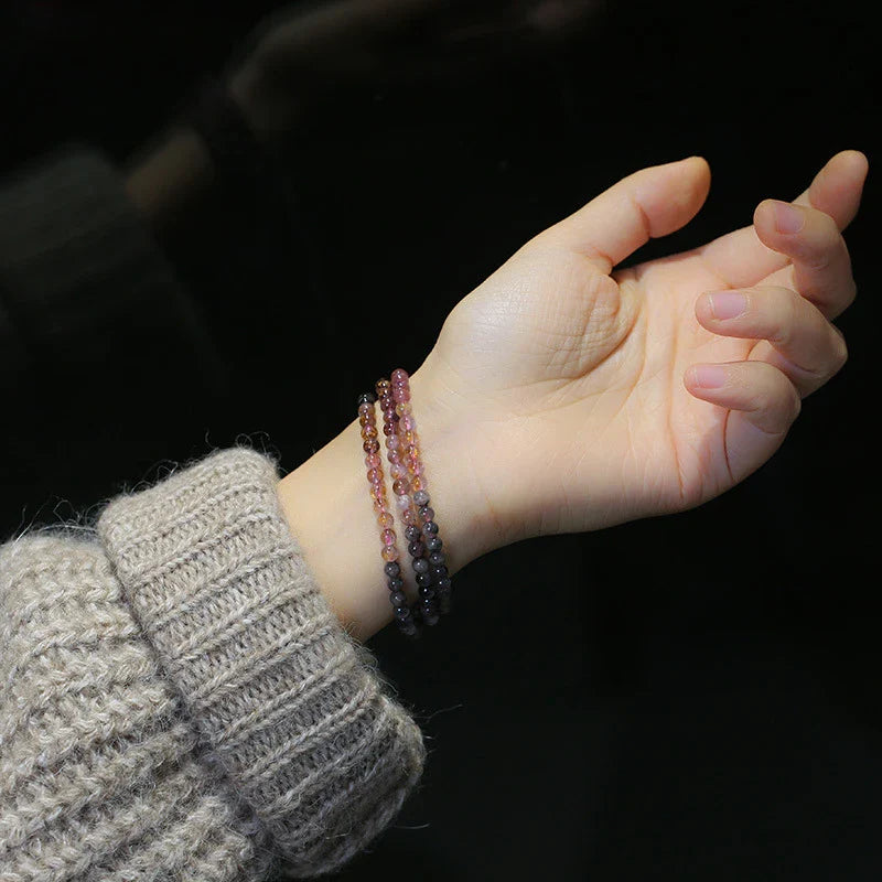 A close-up view of a ladies' fashion bracelet featuring a single loop design with sparkling crystal beads