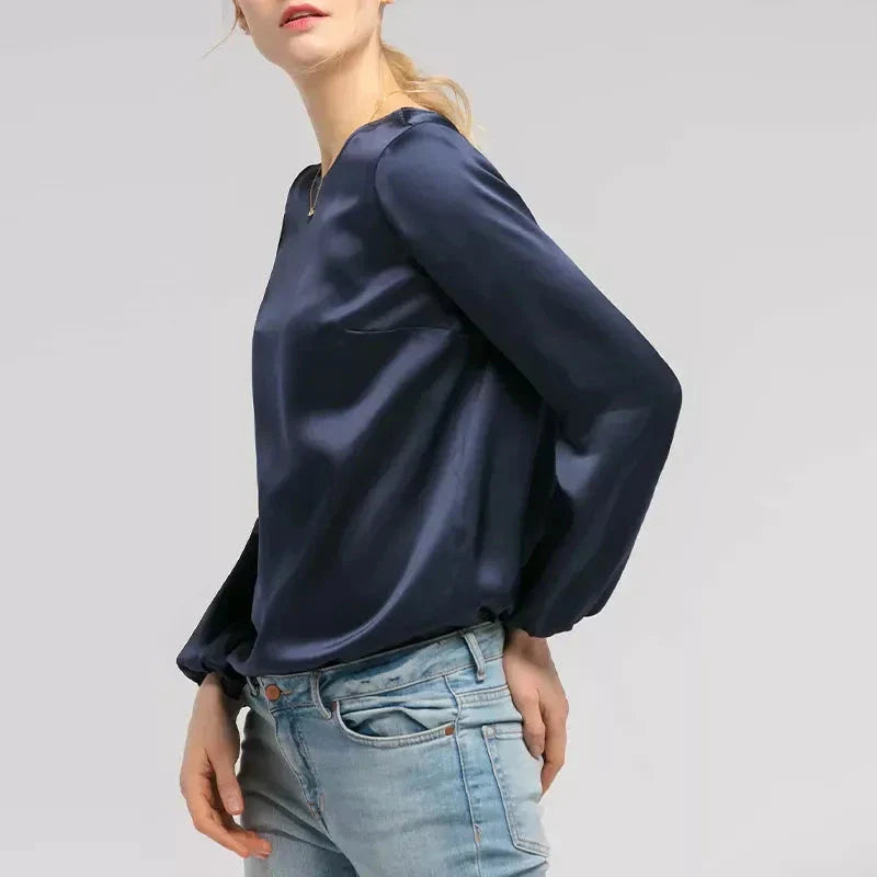 Elegant women's satin long sleeve blouse in dark blue colour with a relaxed yet refined silhouette
