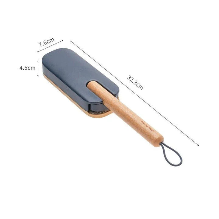 Premium pet hair removal brush with grey handle and bristles, designed for use in UK homes