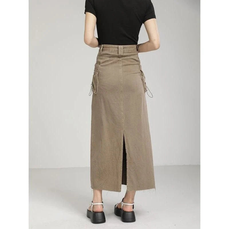 Elegant autumn vintage high-waist denim cargo skirt with pockets, featuring a flattering A-line silhouette and practical design