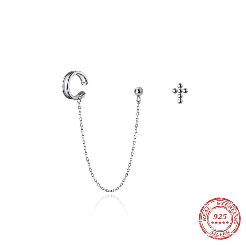 Asymmetric sterling silver one-piece earring and ear clip set with a modern and distinctive design