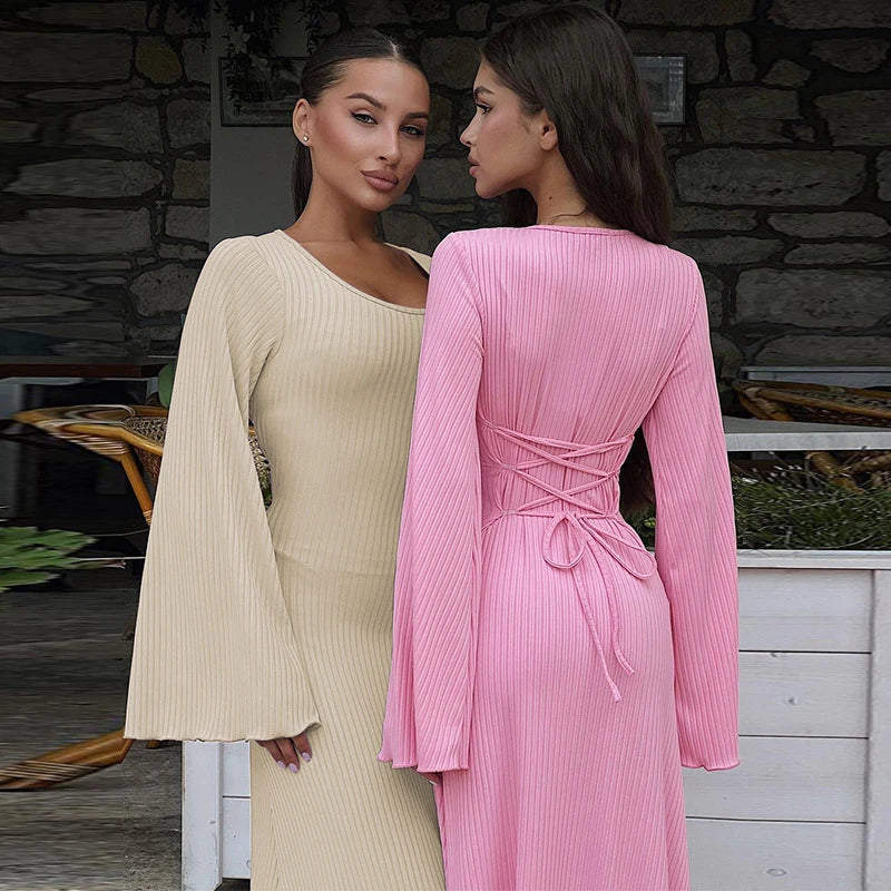 Elegant U-neck dress with lace-up back and flowing bell sleeves in a variety of sophisticated colours