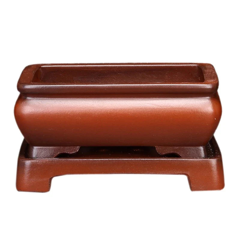 Elegant ceramic bonsai planter in red and dark green colours, with a refined antique-inspired design suitable for desktop or indoor use