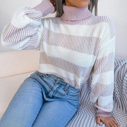 Cosy and stylish high-neck striped sweater in various colours, featuring lantern sleeves and a relaxed fit for all-day comfort.