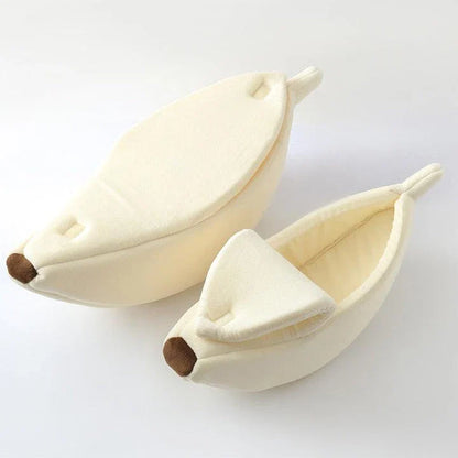 A cosy, banana-shaped cat bed made of plush, supportive materials in various vibrant colours to provide a comfortable and stylish retreat for feline friends.