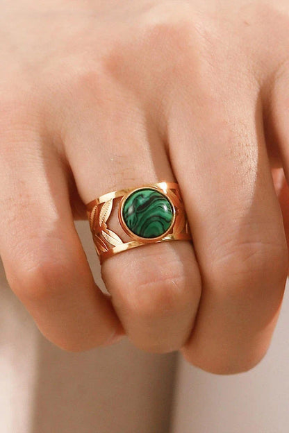 Elegant 18K gold-plated malachite leaf ring in a flat lay, studio style photograph