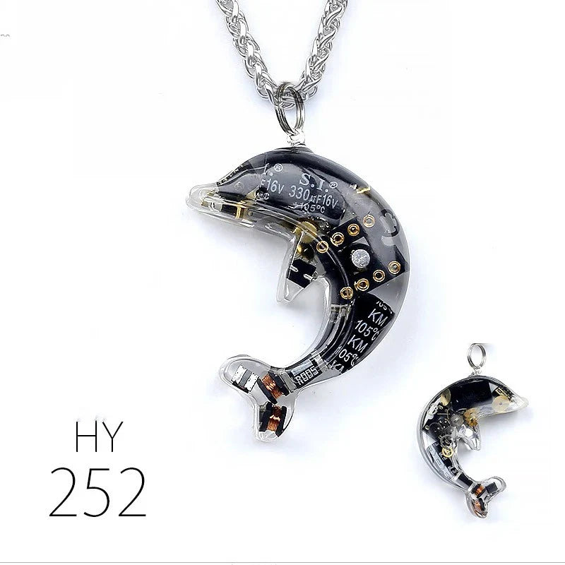 Steampunk-inspired dolphin pendant necklace with electronic components and brass accents