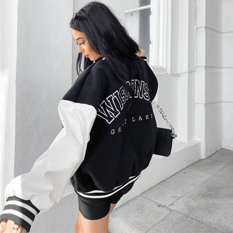 A classic British-style baseball jacket with contrast PU stitching, showcasing a sophisticated and versatile design for casual wear.