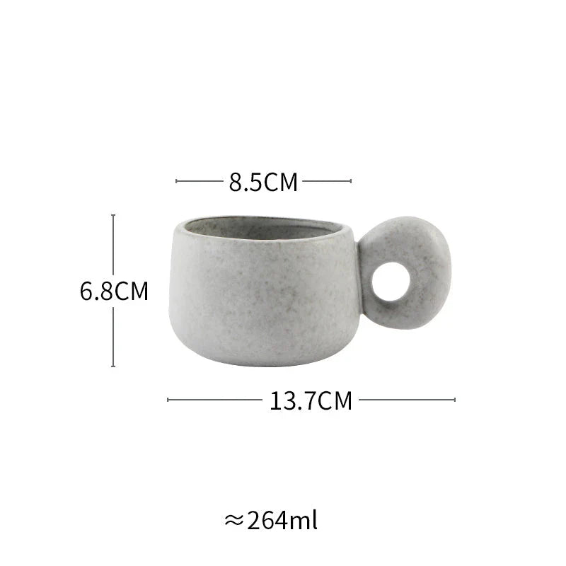 Elegant Japanese stoneware retro coffee mug in solid apricot and grey colours with comfortable handgrip shape