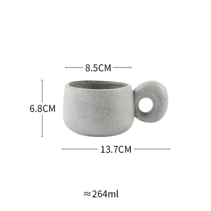 Elegant Japanese stoneware retro coffee mug in solid apricot and grey colours with comfortable handgrip shape