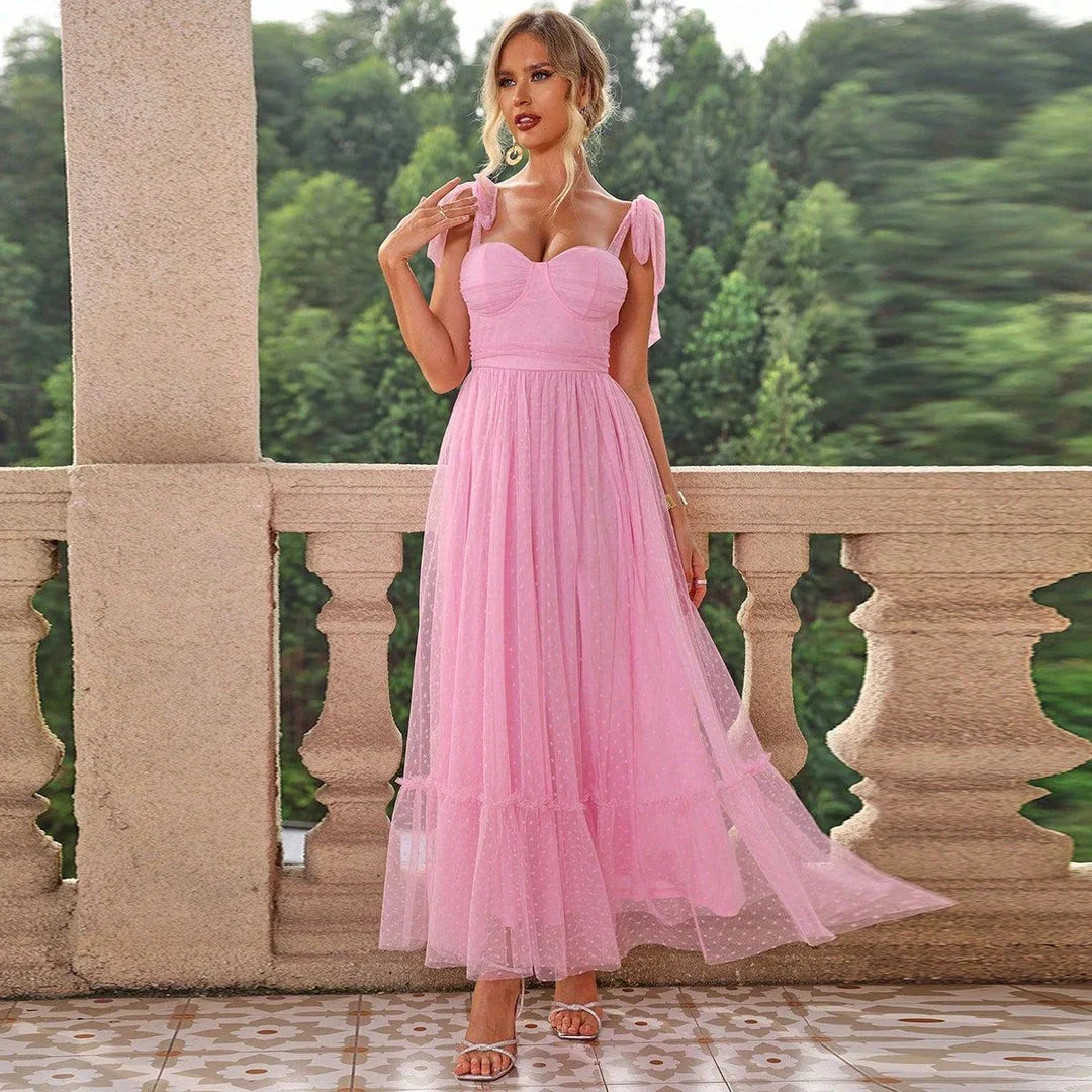 Enchanting fairy-style dress with flowing silhouette, delicate lace accents, and mid-length skirt in a classic black colour