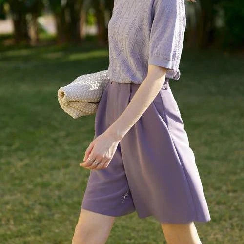 Elegant wide-leg shirred shorts in deep blue, designed for the modern British woman