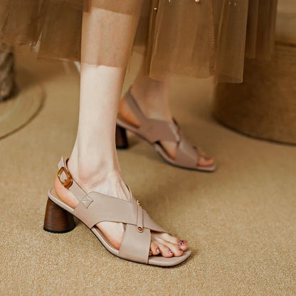 Elegant leather high heel sandals in khaki colour for women, featuring a 5.5 cm square heel, secure buckle strap, and sleek design.