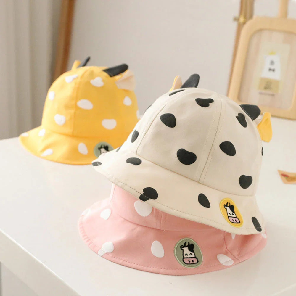 Adorable cow-patterned kids' bucket hat made of soft, breathable cotton for comfortable outdoor wear