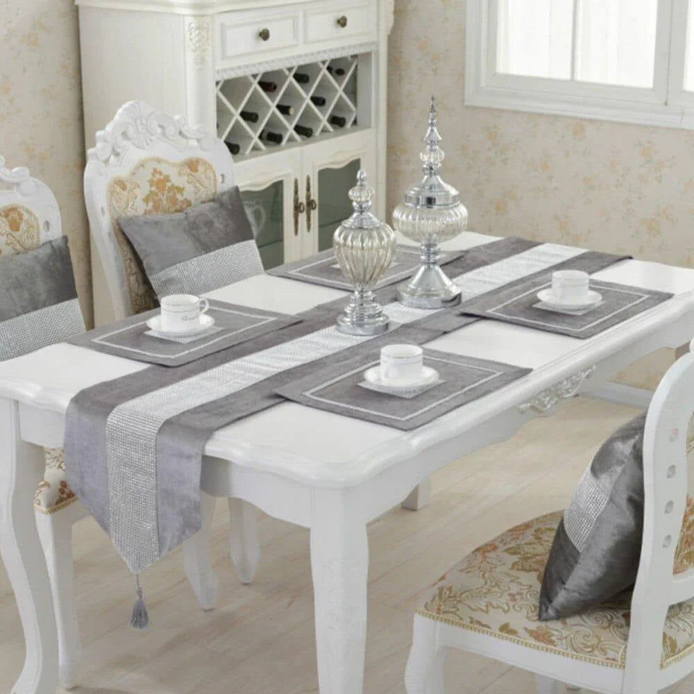 Elegant crystal-trimmed table runner with 4 coordinating beige placemats, creating a refined and sophisticated dining setting