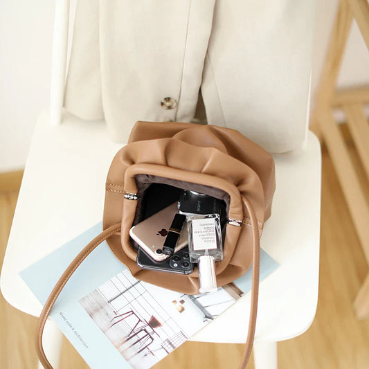 Chic retro dumpling bag made with soft, premium PU material in a one-shoulder diagonal design