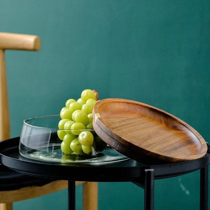 A transparent glass storage canister with a wooden lid, offering elegant and functional kitchen storage