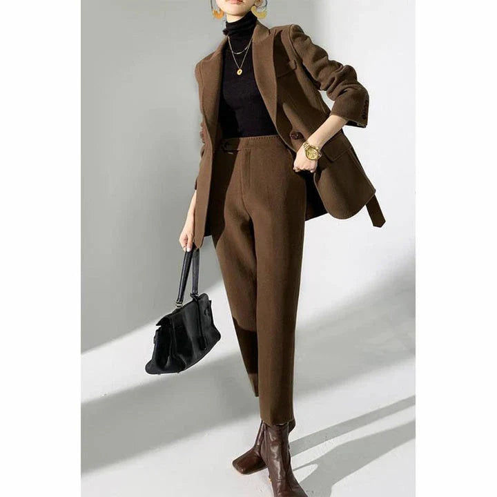Elegant wool pant suits for women featuring a high-waist design, raglan sleeves, and modern 'hip hop' style trousers in a solid black colour