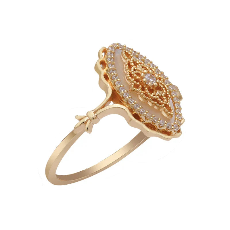 Elegant vintage-style natural white shell ring with silver construction, available in sizes 5 to 8