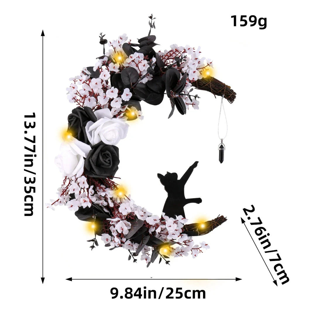 Spooktacular Halloween garland featuring a blend of dried white flowers, black roses, and mystical moon cat ornaments
