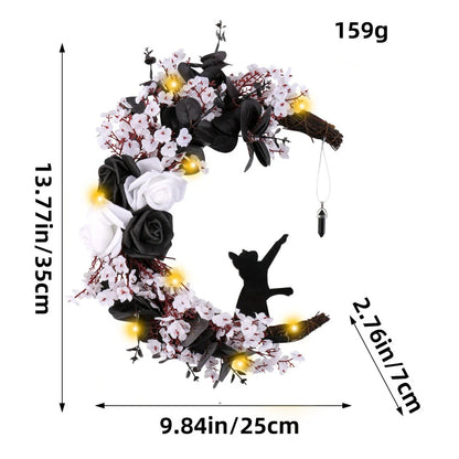 Spooktacular Halloween garland featuring a blend of dried white flowers, black roses, and mystical moon cat ornaments