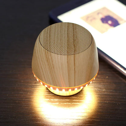 Compact wireless Bluetooth speaker with mushroom-inspired bionic design and night light function