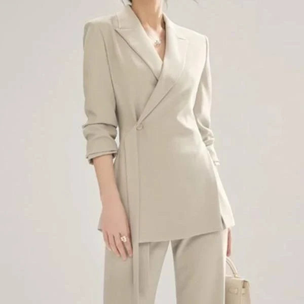 Elegant vintage-inspired two-piece office suit with tailored blazer and high-waisted trousers in premium polyester fabric