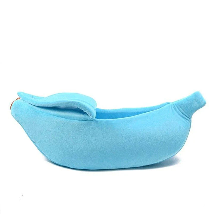 A cosy, banana-shaped cat bed made of plush, supportive materials in various vibrant colours to provide a comfortable and stylish retreat for feline friends.