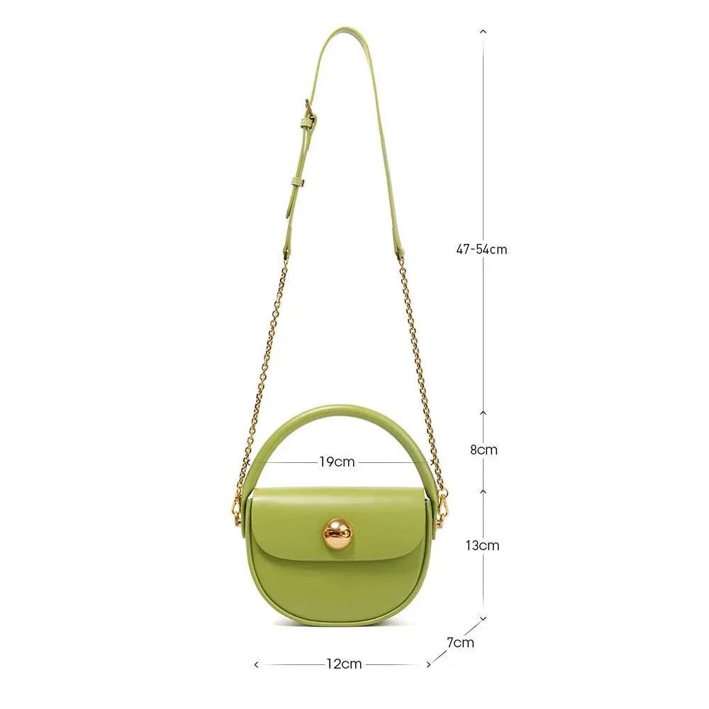 Exquisite red leather round handbag with ball-inlaid hardware, a chic and versatile accessory for UK fashion enthusiasts