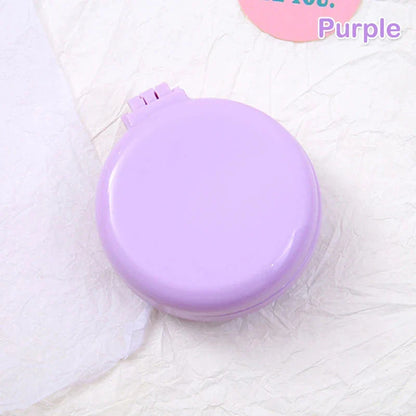 Portable folding hair comb with mirror, featuring a dual-sided design with a round mirror and eco-friendly hairbrush for on-the-go styling and grooming