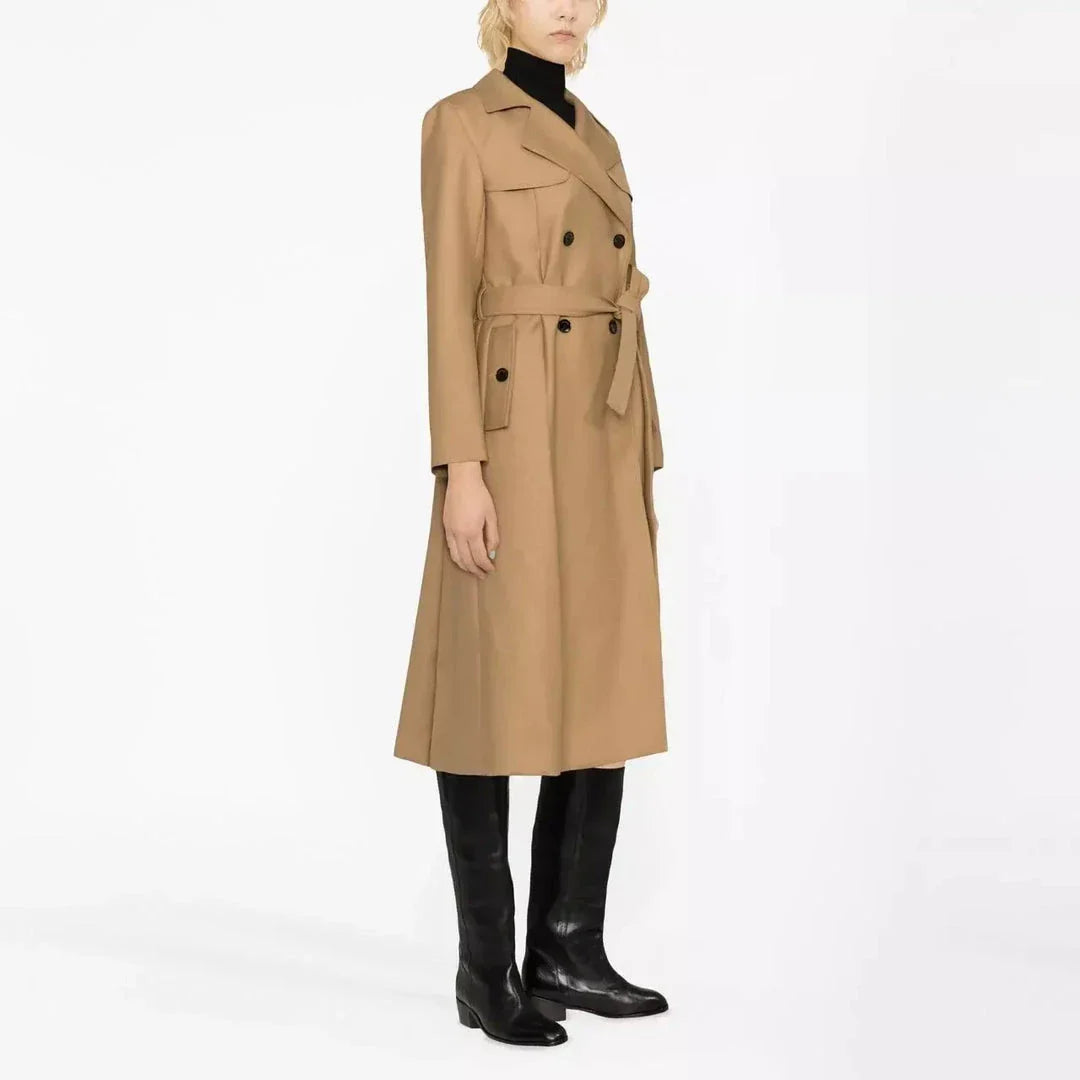 Elegant double-breasted women's trench coat in beige, featuring a classic collar, wide-waisted design, and practical pockets for a sophisticated and timeless look.