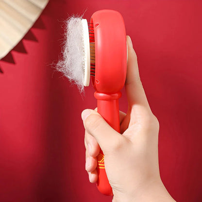 One-Click Pet Hair Removal Comb in red colour, designed to effectively remove loose fur and tangles from cat or dog coats