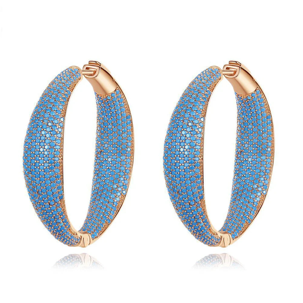 Pair of stunning blue gemstone drop earrings with a regal crown design, inlaid with shimmering zircon stones