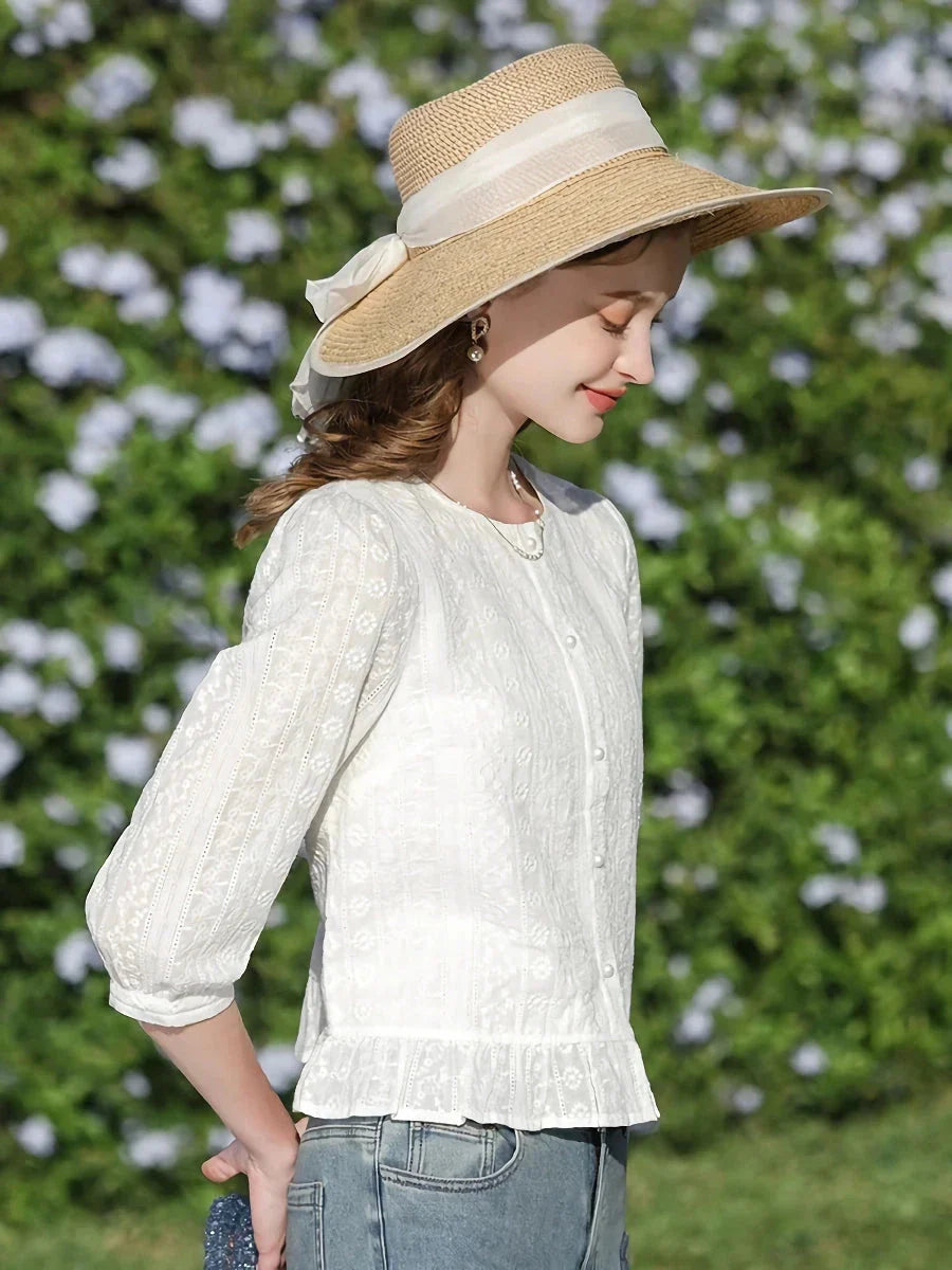 Elegant British-inspired white cotton puff sleeve blouse with a tailored regular fit and feminine flair