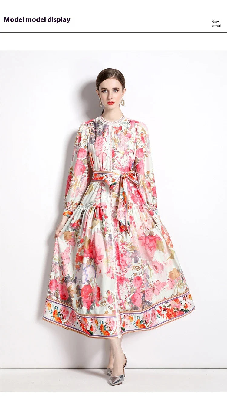 Elegant floral single-breasted swing dress with delicate print, tailored design, and flowing silhouette