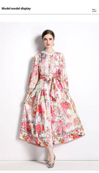 Elegant floral single-breasted swing dress with delicate print, tailored design, and flowing silhouette