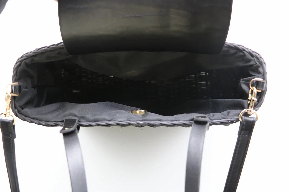 Handwoven rattan handbag in black with a sleek, elegant design for effortless style and practicality